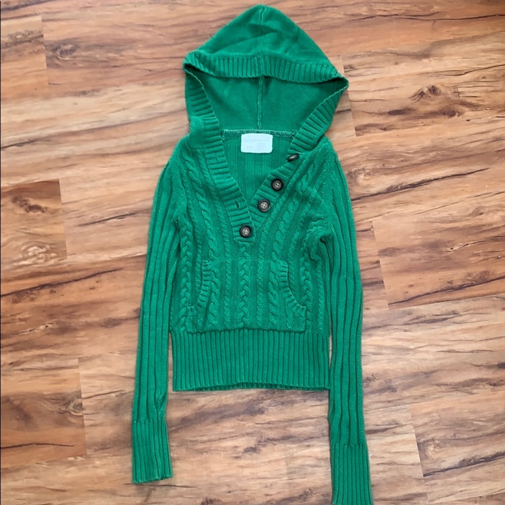 Cable knit sweater with buttons and hood